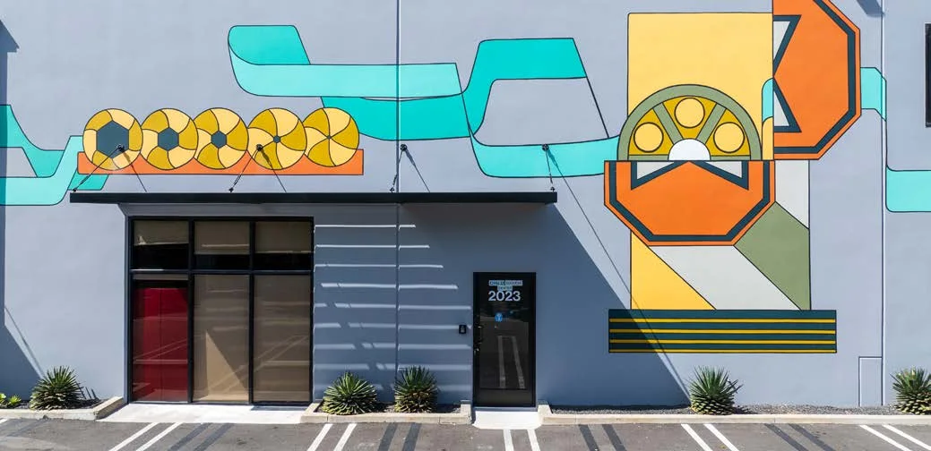 Film-reel mural and entrance at Westgate Media Park